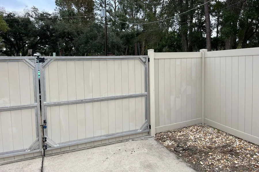 Tan PVC privacy fence at a residential property