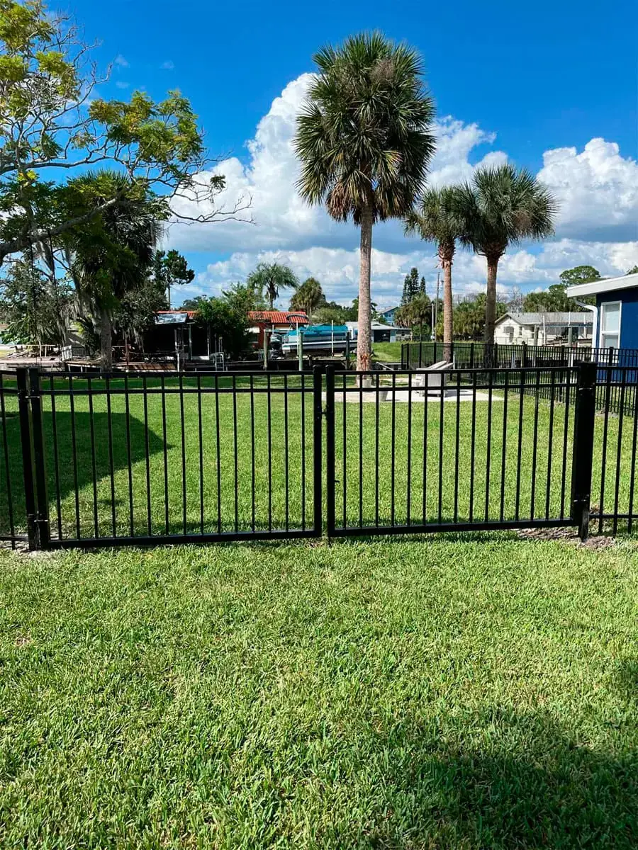 Black aluminum fence and gate at a Florida property