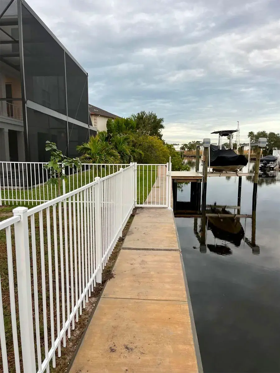 Custom aluminum railing and gate along a waterfront property