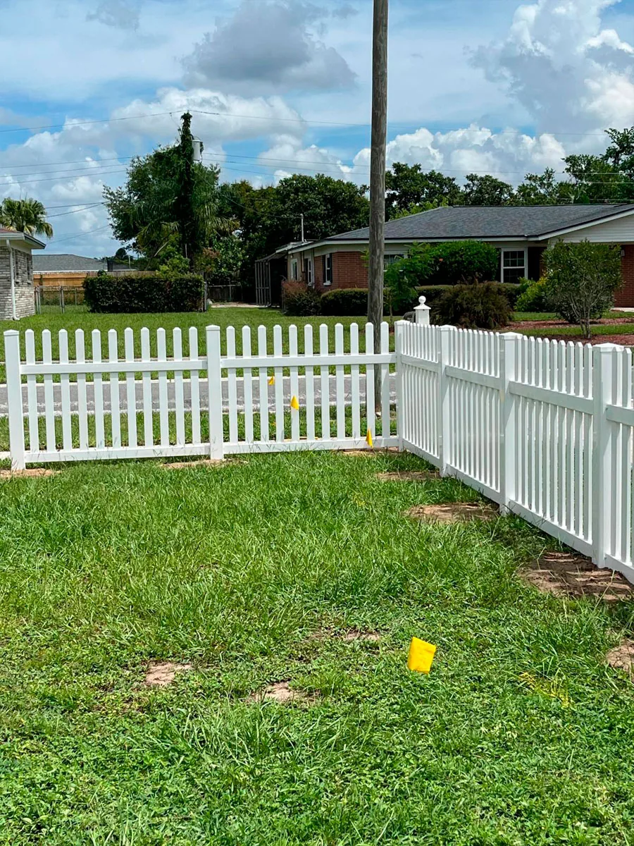 White PVC picket fence at a residential property