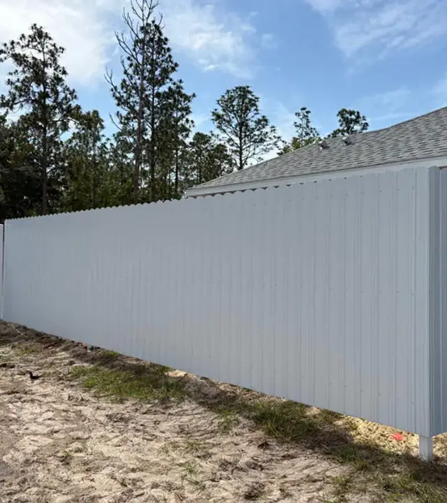 White Durafence steel privacy fence around a residential yard